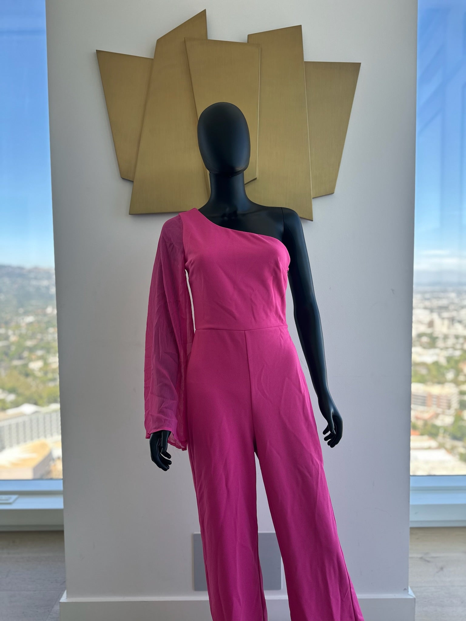 Pink one sleeve jumpsuit. Medium
