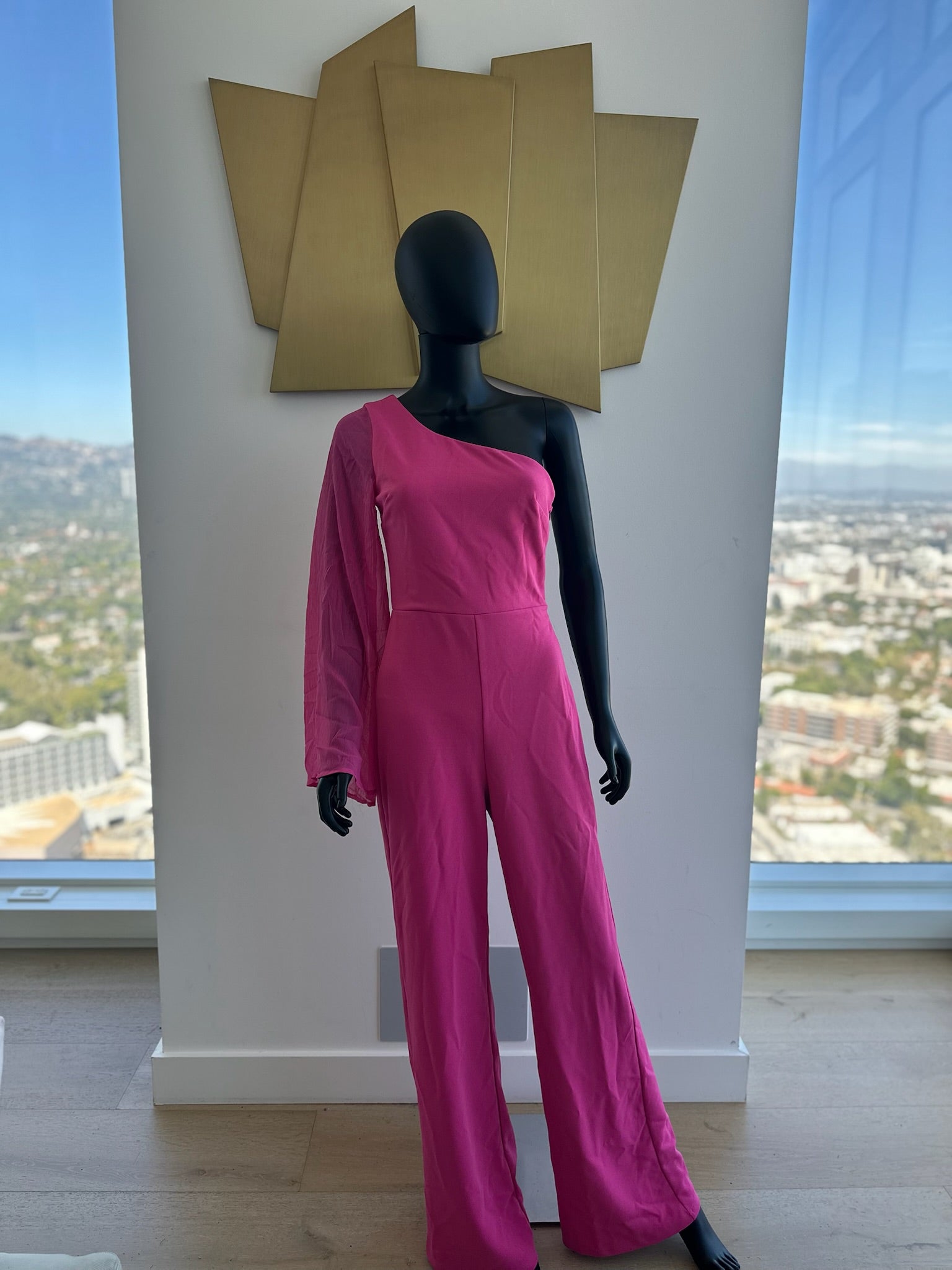 Pink one sleeve jumpsuit. Medium